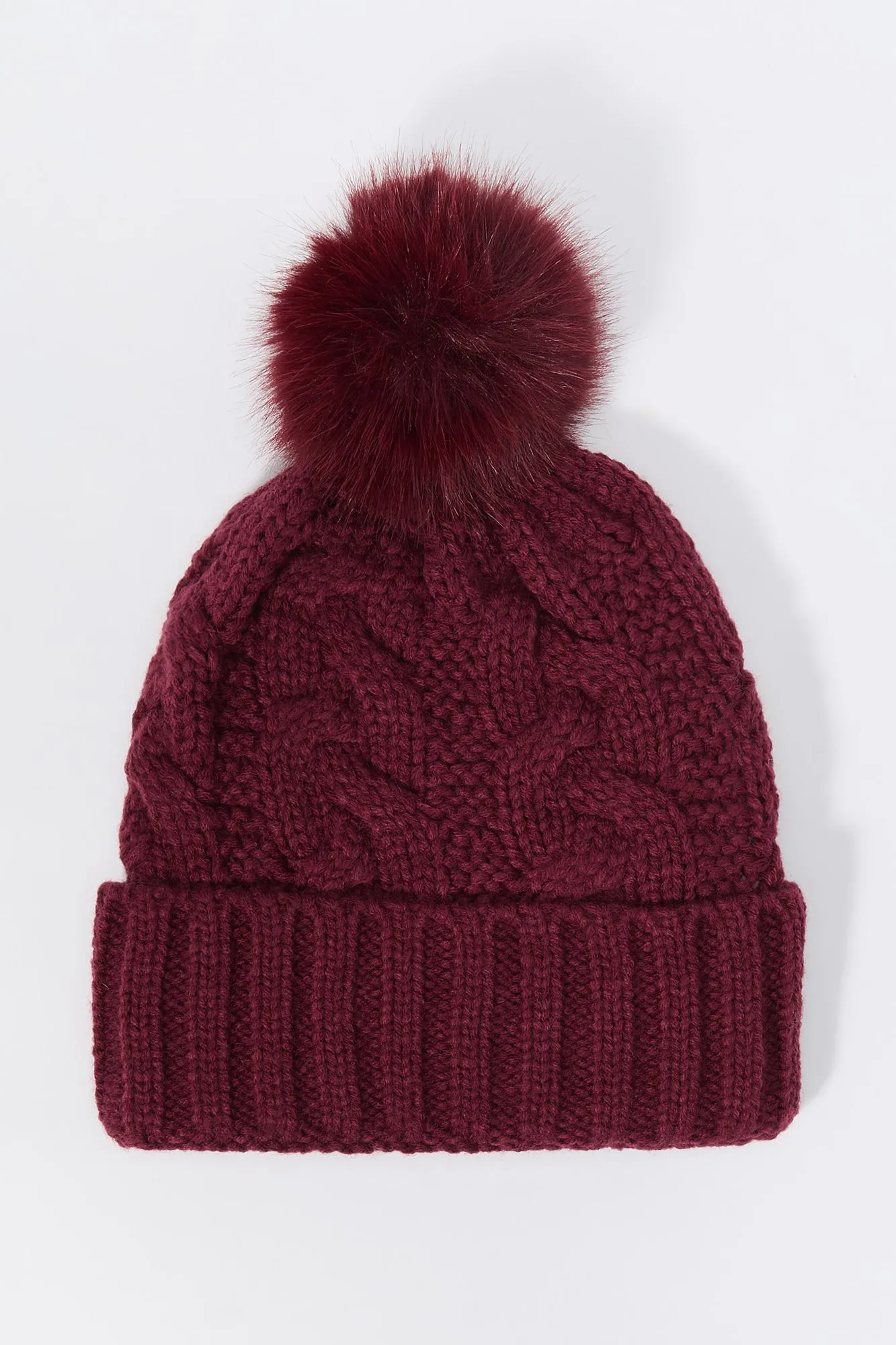 Cable Knit Beanie with Pom Pom sold by Charlotte Russe