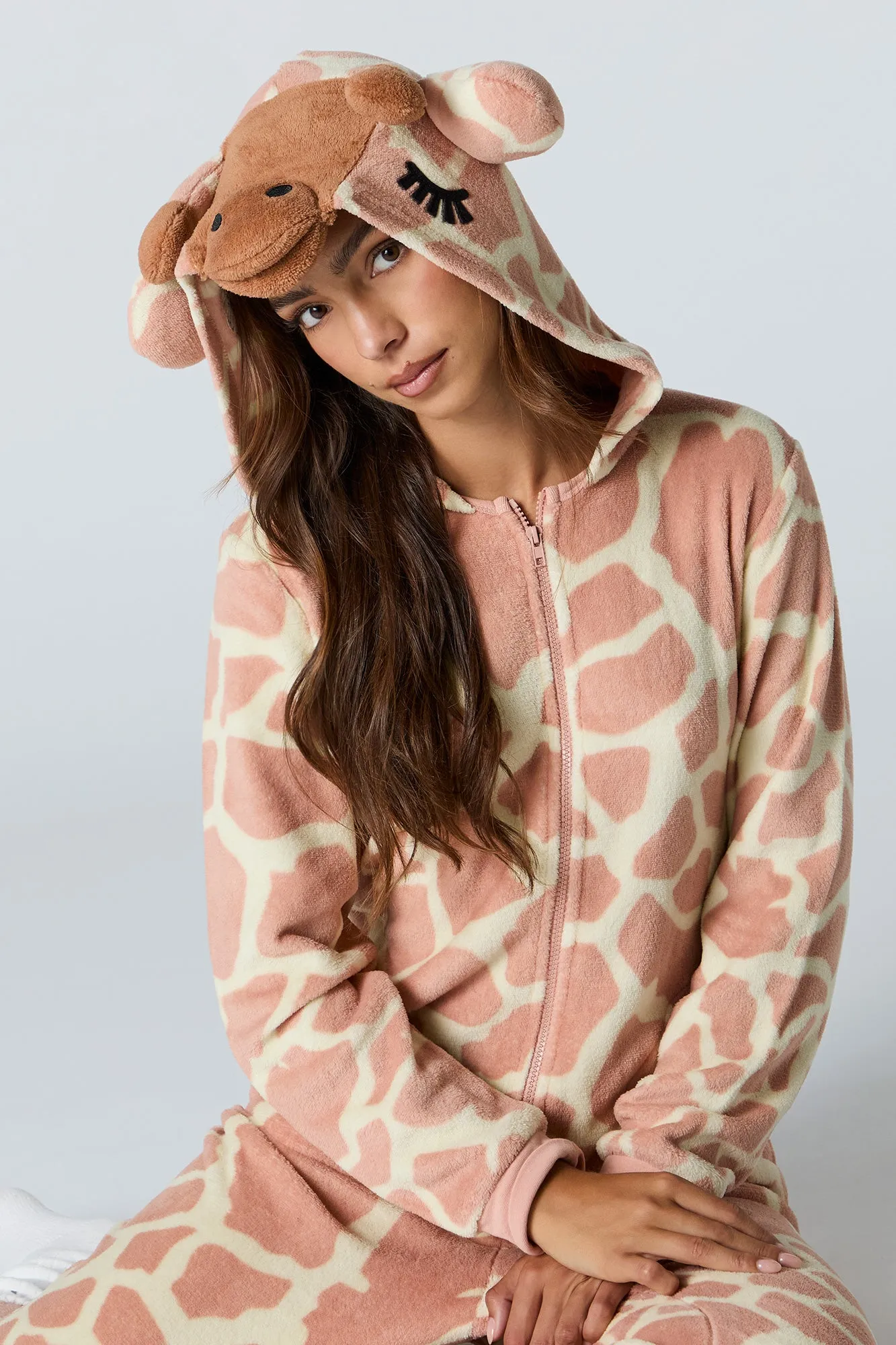3D Giraffe Sherpa Onesie sold by Charlotte Russe