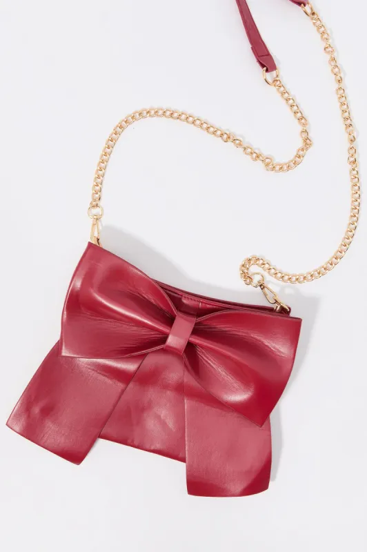 Faux Leather Bow Crossbody Purse sold by Charlotte Russe