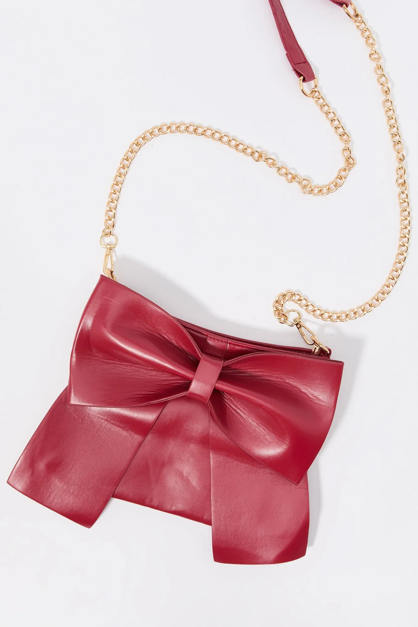 Faux Leather Bow Crossbody Purse sold by Charlotte Russe