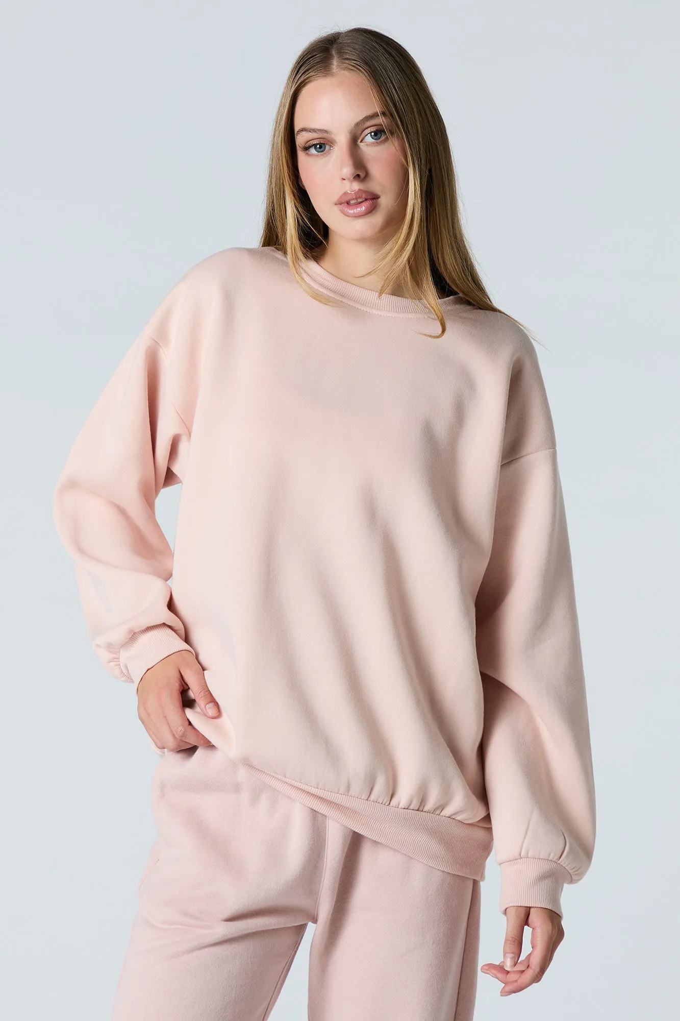 Oversized Fleece Sweatshirt sold by Charlotte Russe