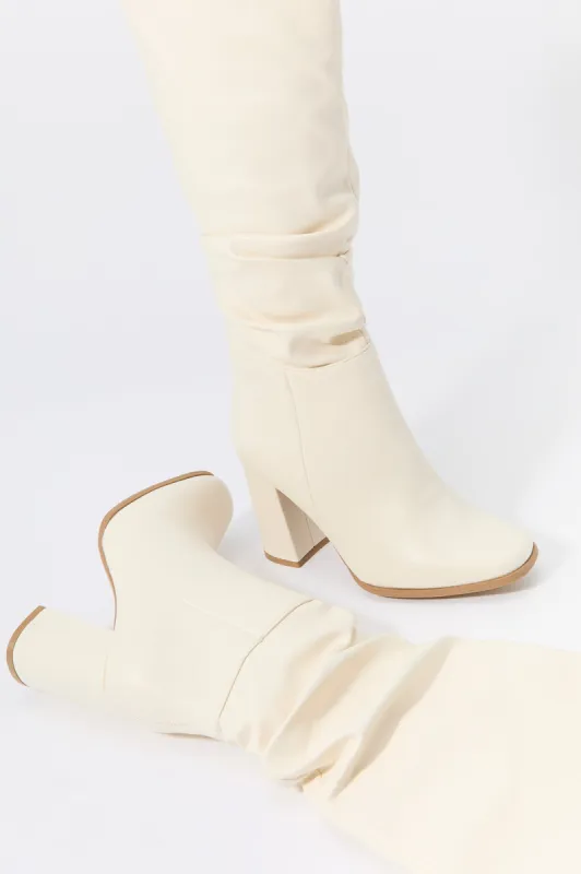 Faux Leather Slouchy Heeled Boot sold by Charlotte Russe