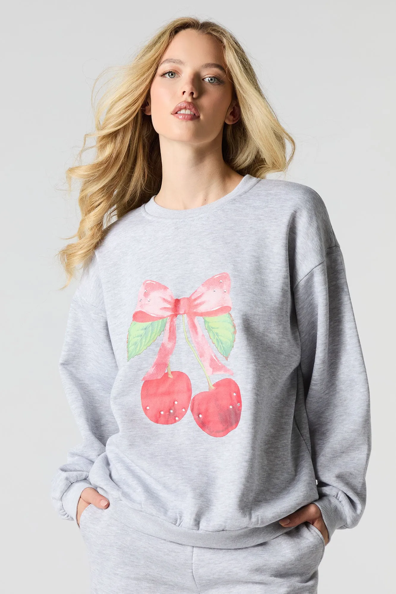 Oversized Cutesy Graphic Rhinestone Fleece Sweatshirt sold by Charlotte Russe