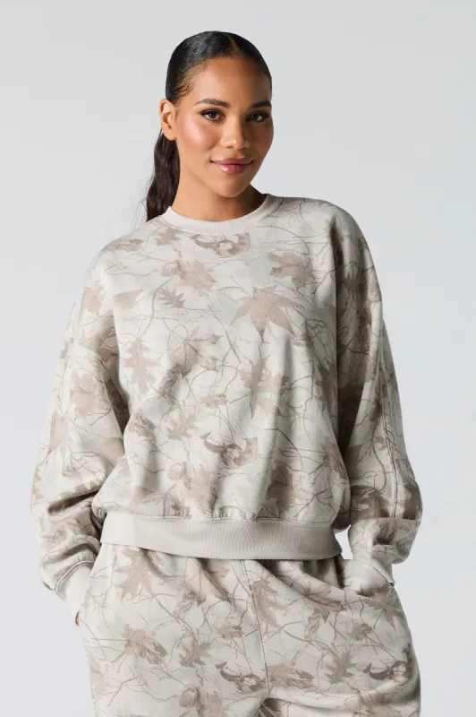 Camo Leaf Print Fleece Sweatshirt sold by Charlotte Russe