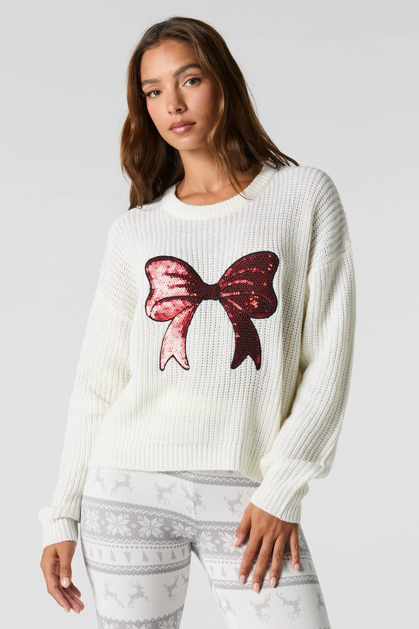 Sequin Bow Ribbed Knit Sweater sold by Charlotte Russe