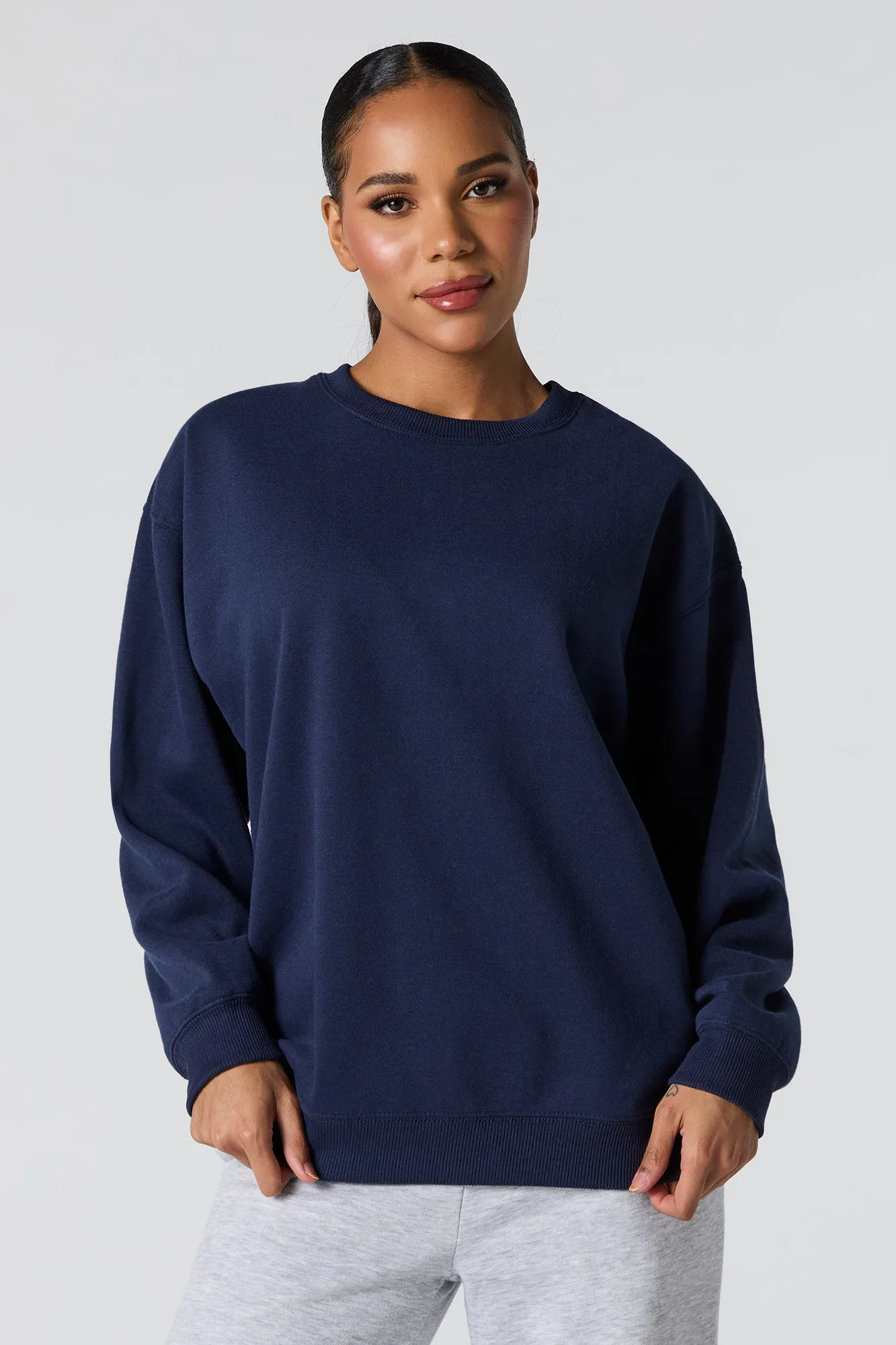 Oversized Solid Fleece Sweatshirt sold by Charlotte Russe