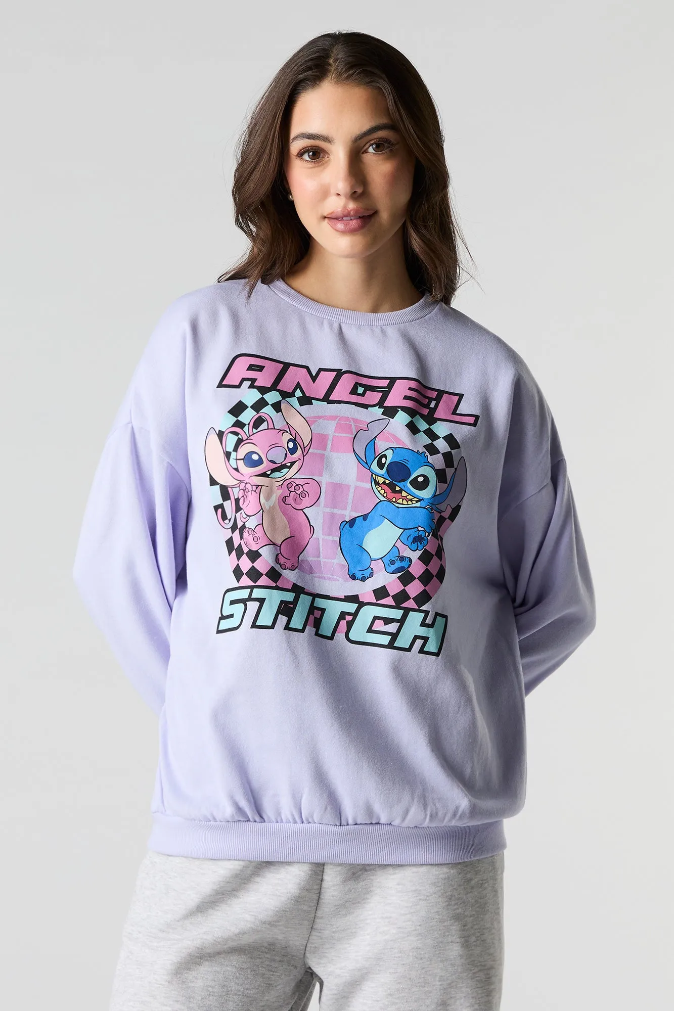 Stitch & Angel Graphic Fleece Sweatshirt sold by Charlotte Russe