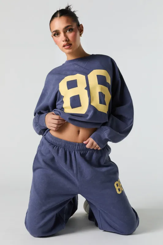 Graphic Washed Crewneck Fleece Sweatshirt sold by Charlotte Russe