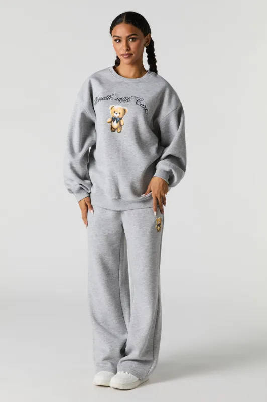 Graphic Fleece Wide Leg Sweatpant sold by Charlotte Russe