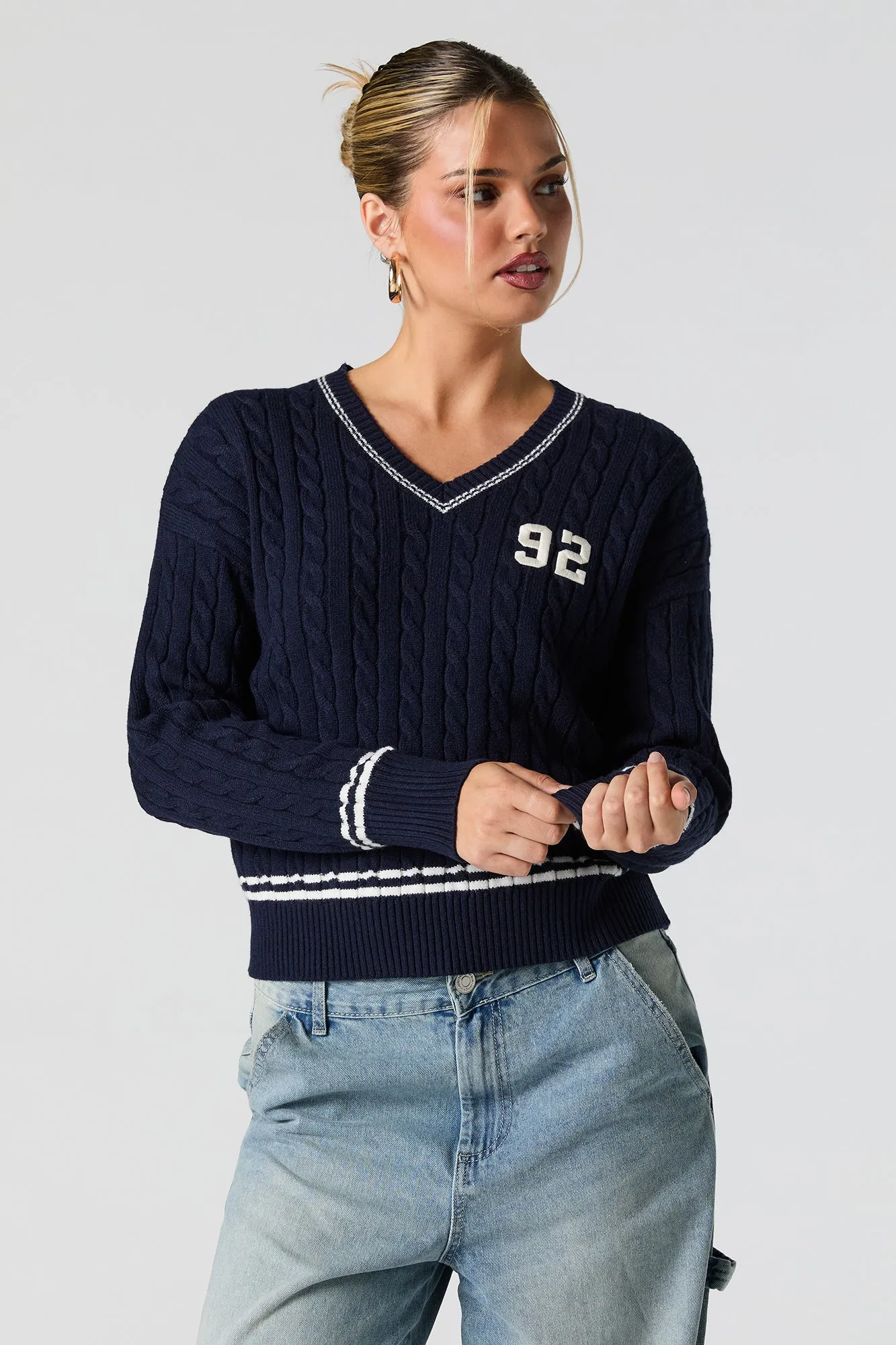 Number Embroidered Cable Knit Sweater sold by Charlotte Russe