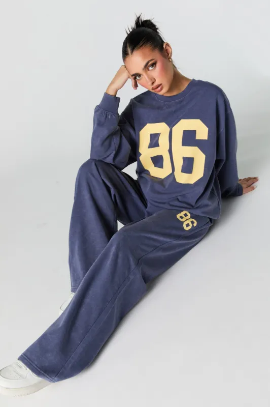 Graphic Washed Wide Leg Fleece Sweatpant sold by Charlotte Russe