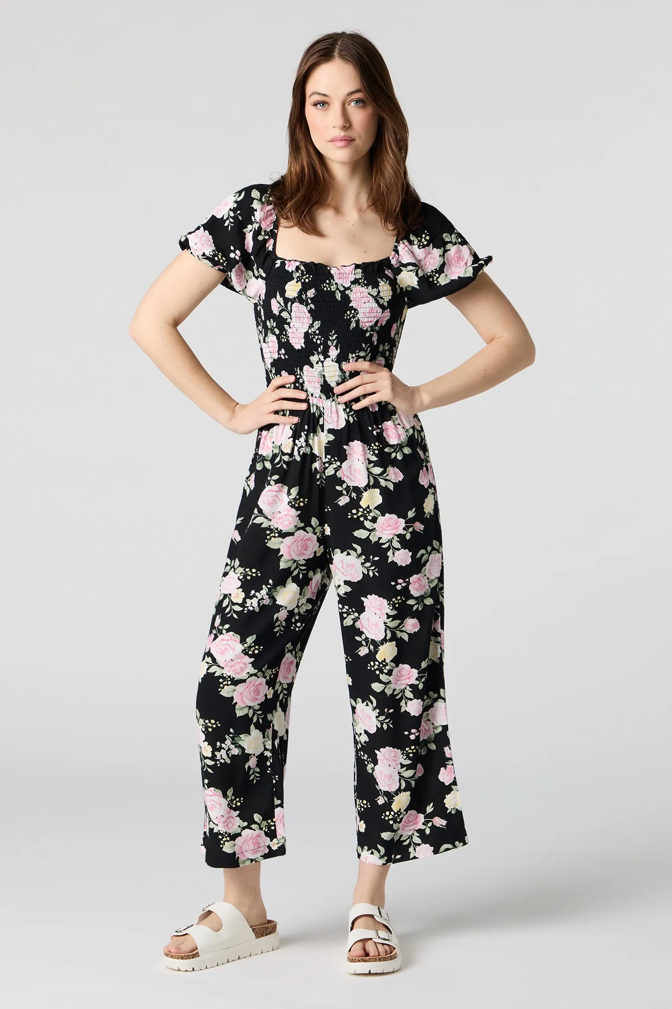 Printed Smocked Jumpsuit sold by Charlotte Russe