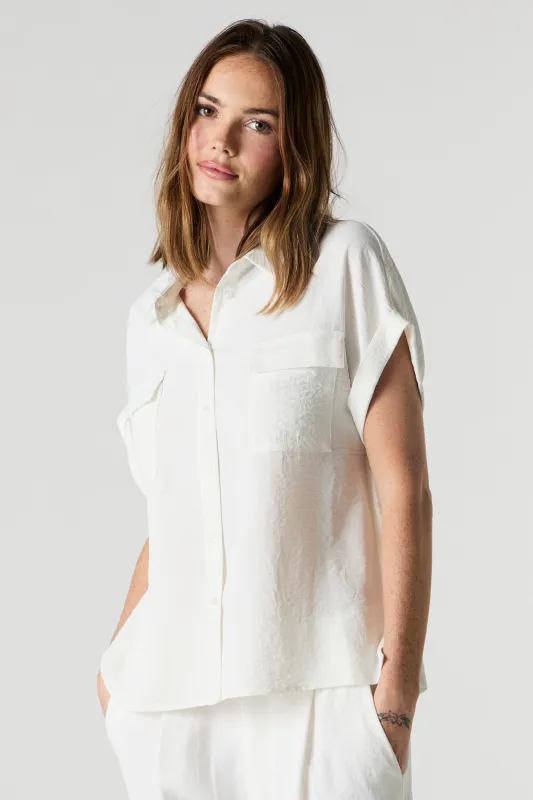 Flowy Short Sleeve Button-Up Top sold by Charlotte Russe