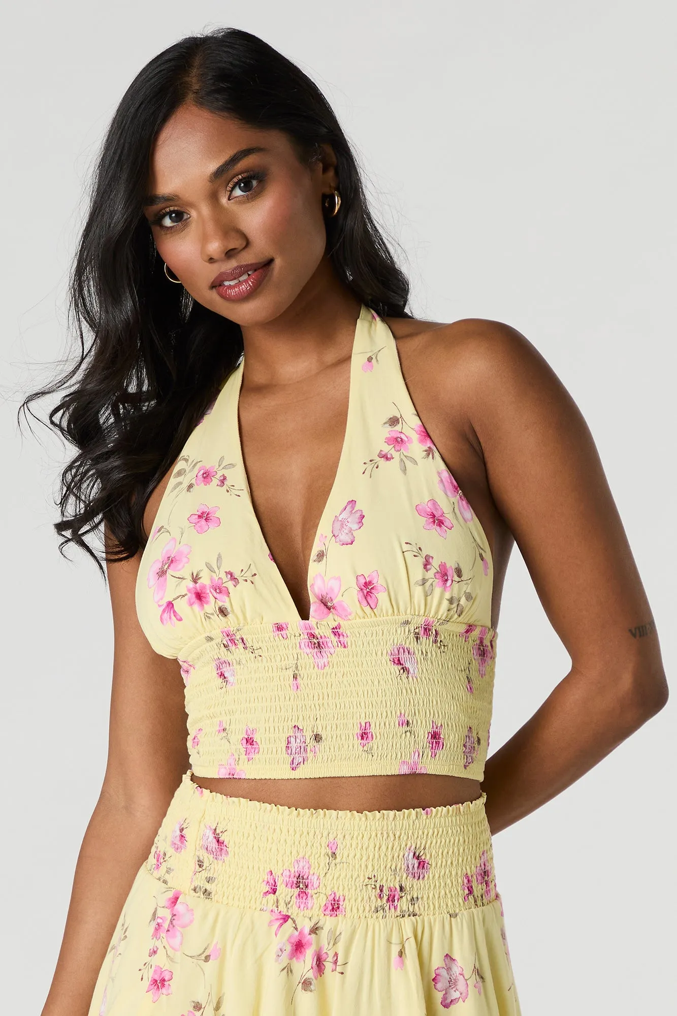 Floral Smocked Halter Top sold by Charlotte Russe