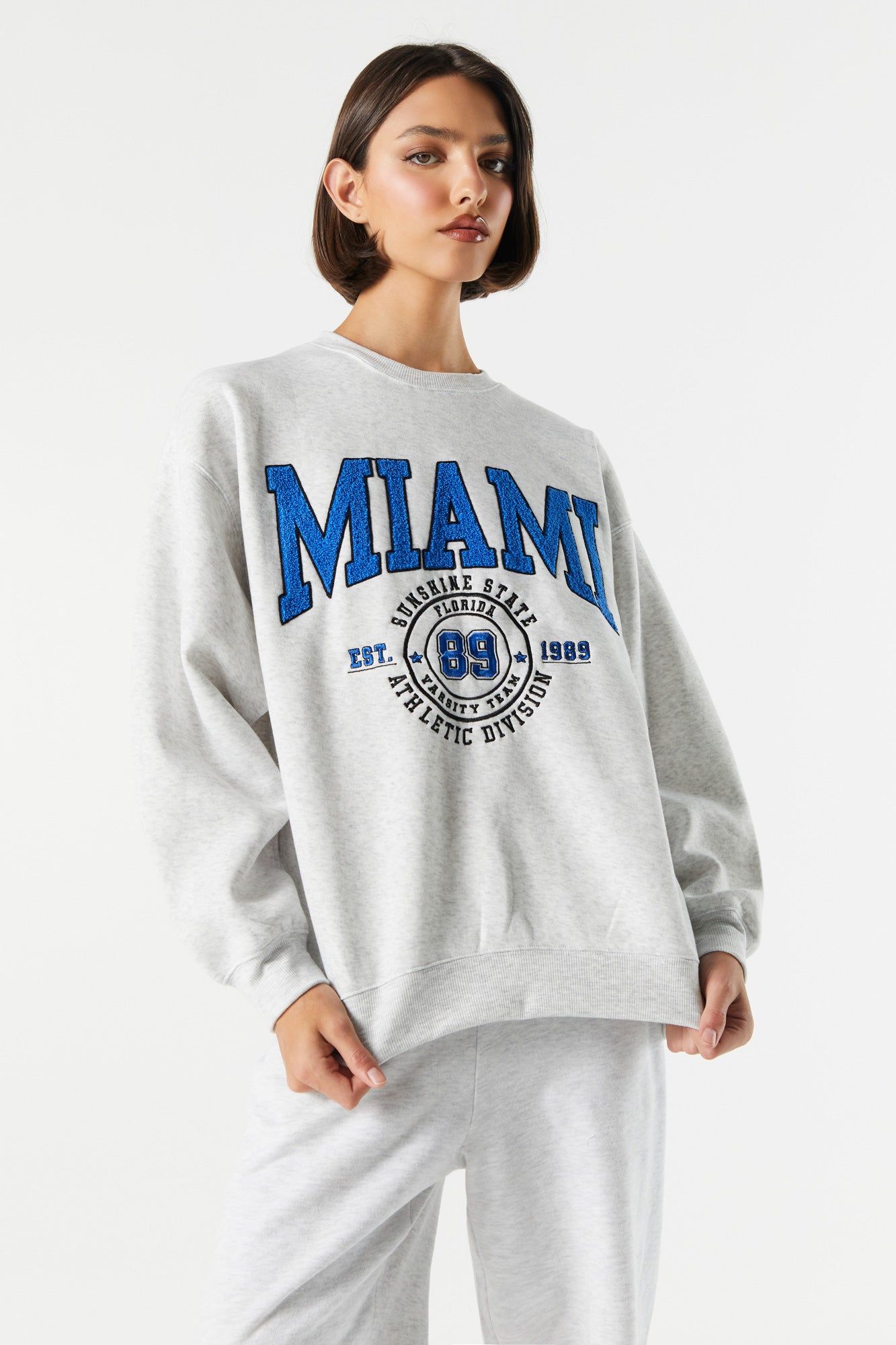 Fleece Miami Graphic Sweatshirt sold by Charlotte Russe