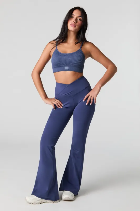 Active Surplice Waist Side Pocket Flare Pant sold by Charlotte Russe