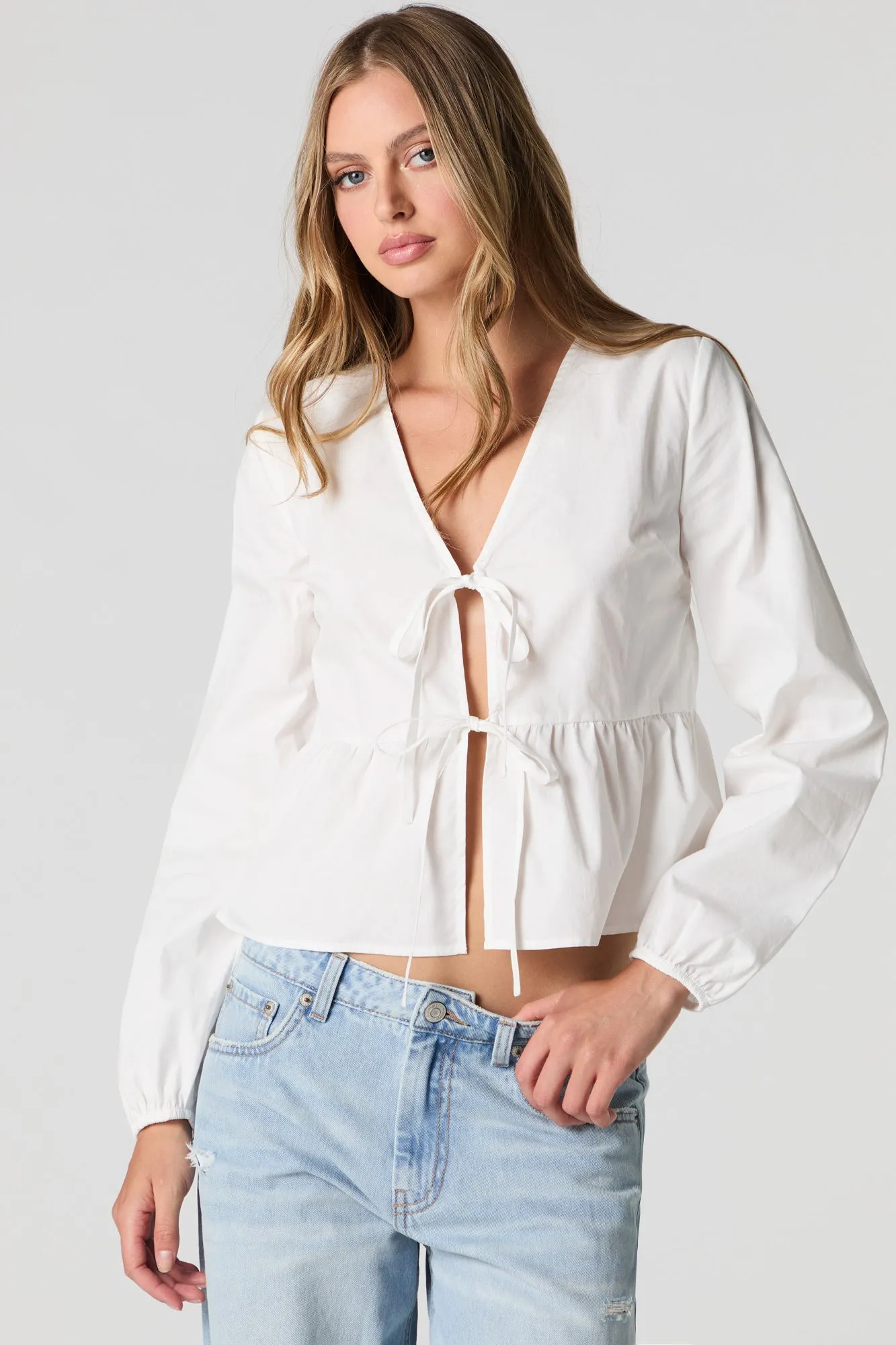 Poplin Tie Front Long Sleeve Top sold by Charlotte Russe