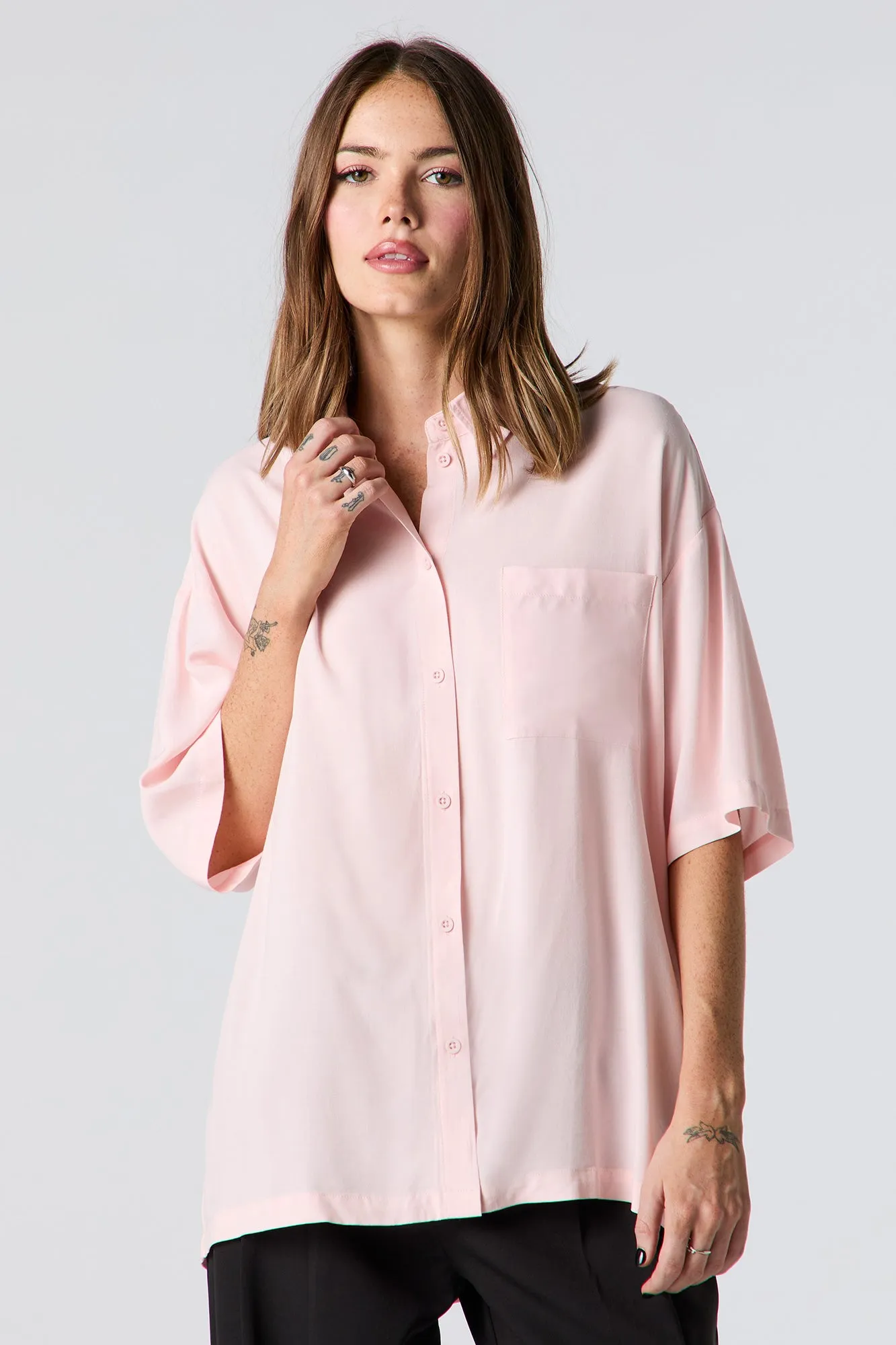 Oversized Short Sleeve Button-Up Top sold by Charlotte Russe