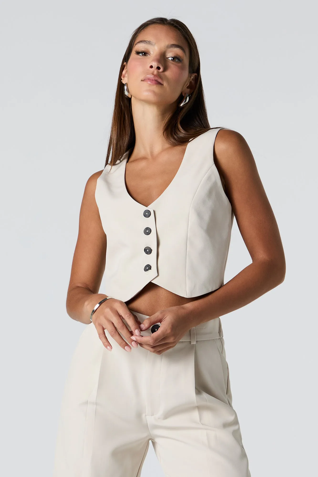 Button Front Cropped Vest sold by Charlotte Russe