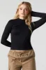 Seamless Ribbed Mock Neck Long Sleeve Top sold by Charlotte Russe