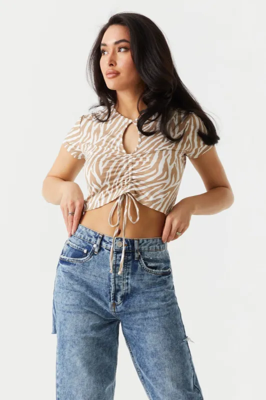 Zebra Print Cinched Front Cut-Out Crop Top sold by Charlotte Russe