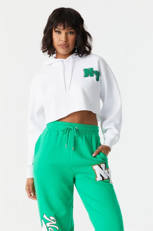 NY Graphic Cropped Fleece Hoodie sold by Charlotte Russe