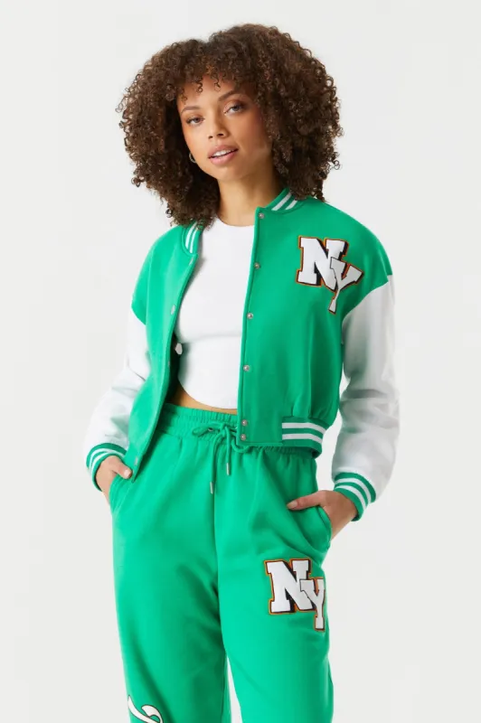 New York Graphic Cropped Varsity Jacket sold by Charlotte Russe
