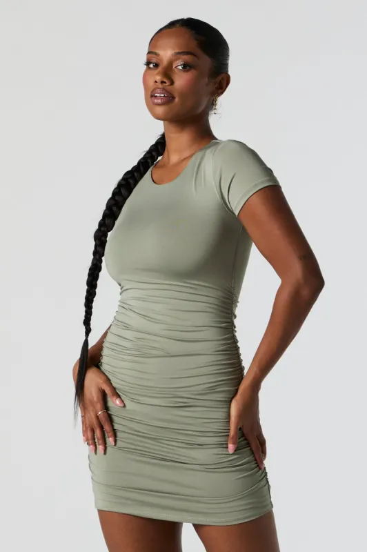 Green Contour Short Sleeve Ruched Mini Dress sold by Charlotte Russe