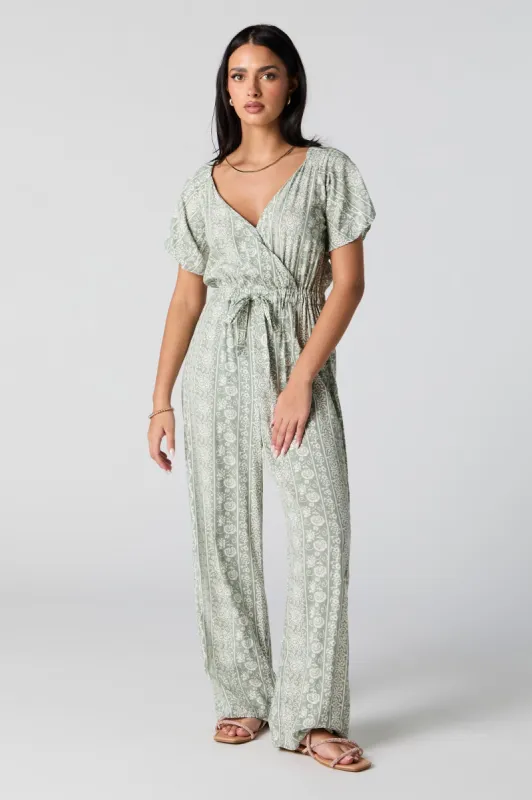 Floral Print Surplice Belted Jumpsuit sold by Charlotte Russe