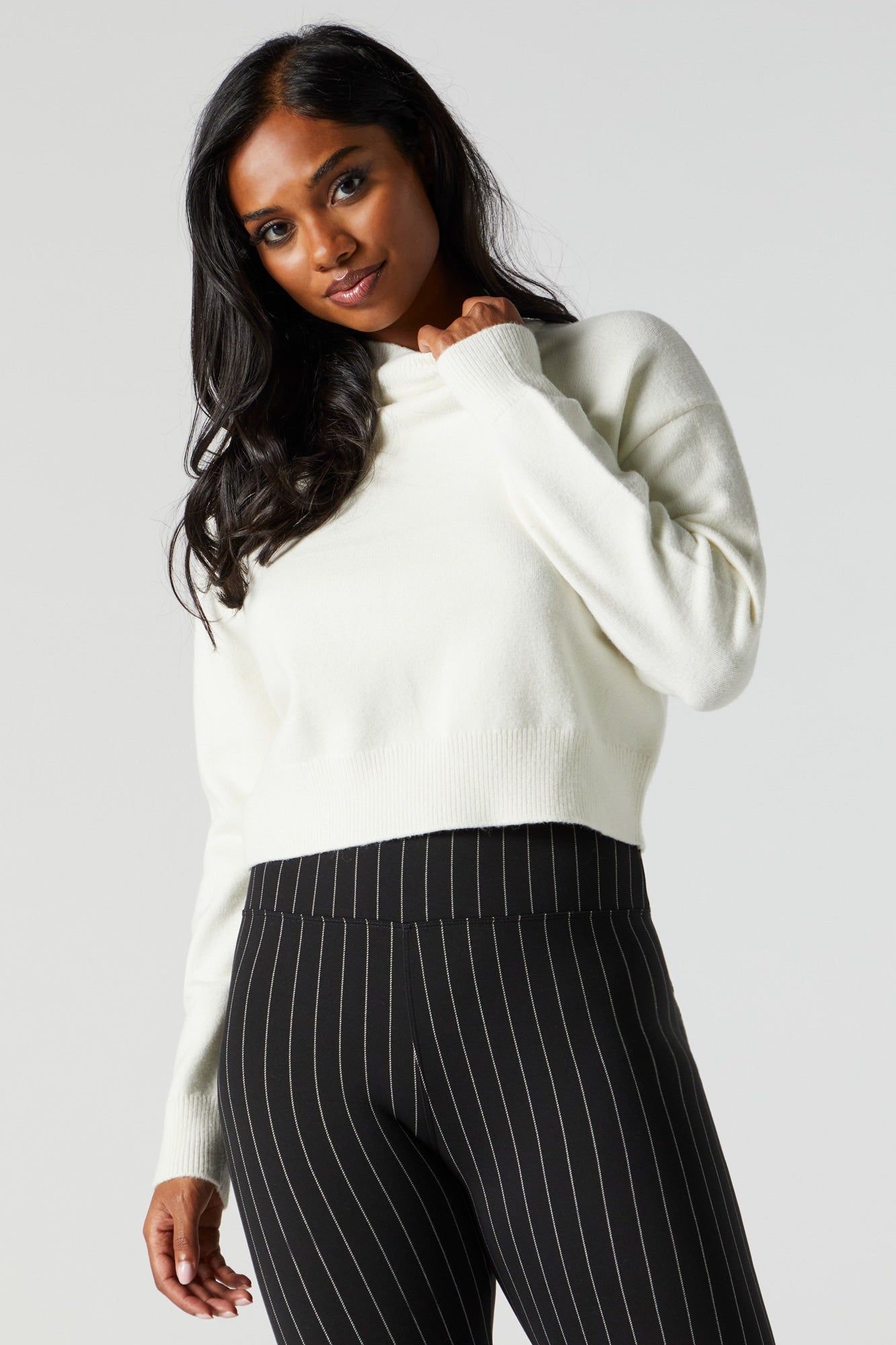 Solid Knit Mock Neck Sweater sold by Charlotte Russe