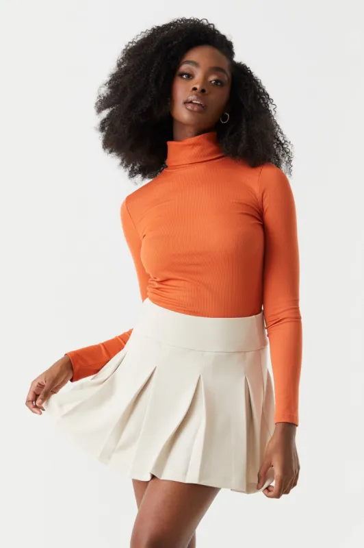 Soft Ribbed Turtle Neck Long Sleeve Top sold by Charlotte Russe