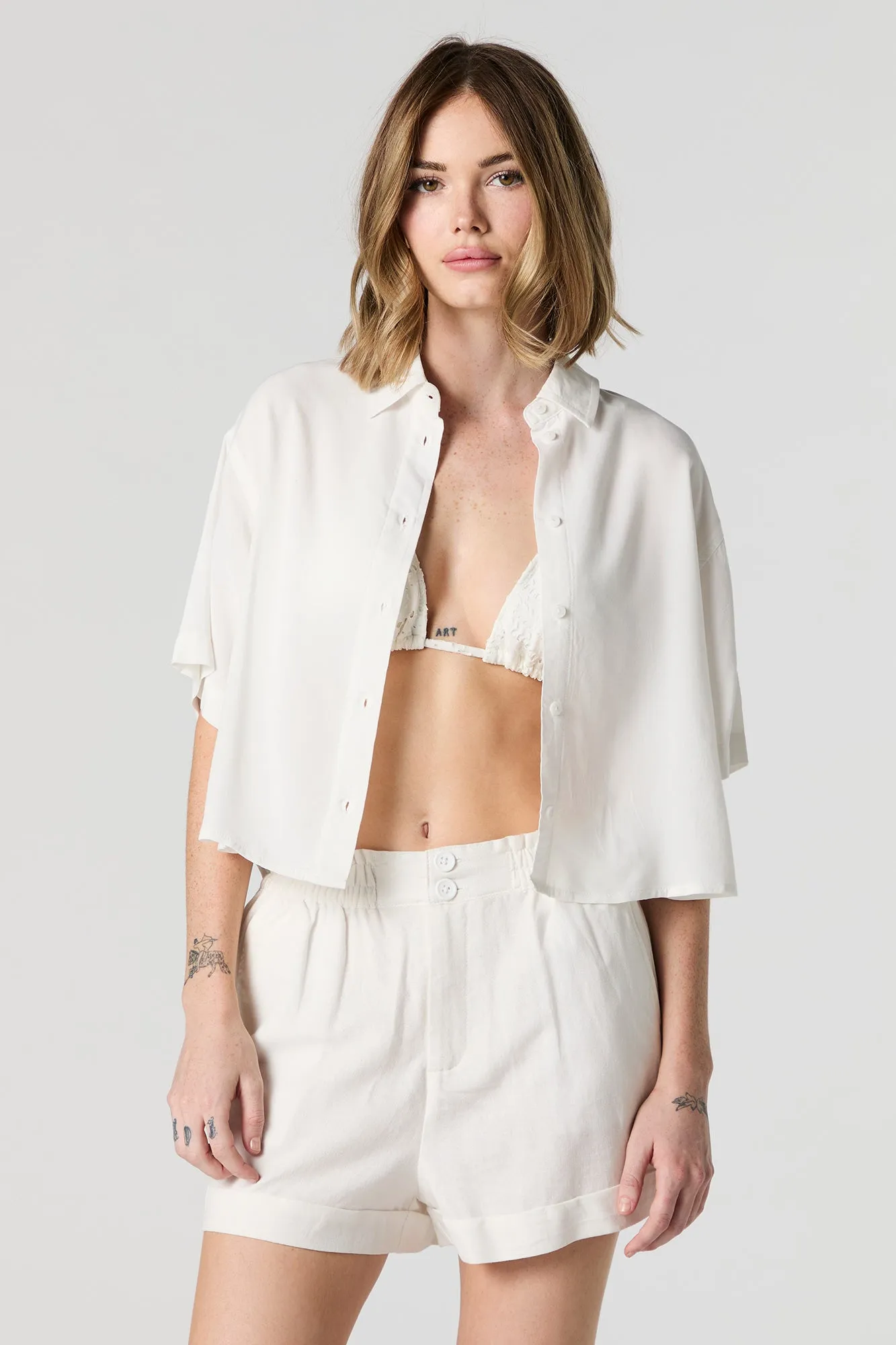 Cropped Button-Up Top sold by Charlotte Russe