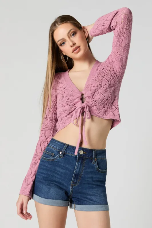 Crochet Front Tie Cropped Long Sleeve Top sold by Charlotte Russe