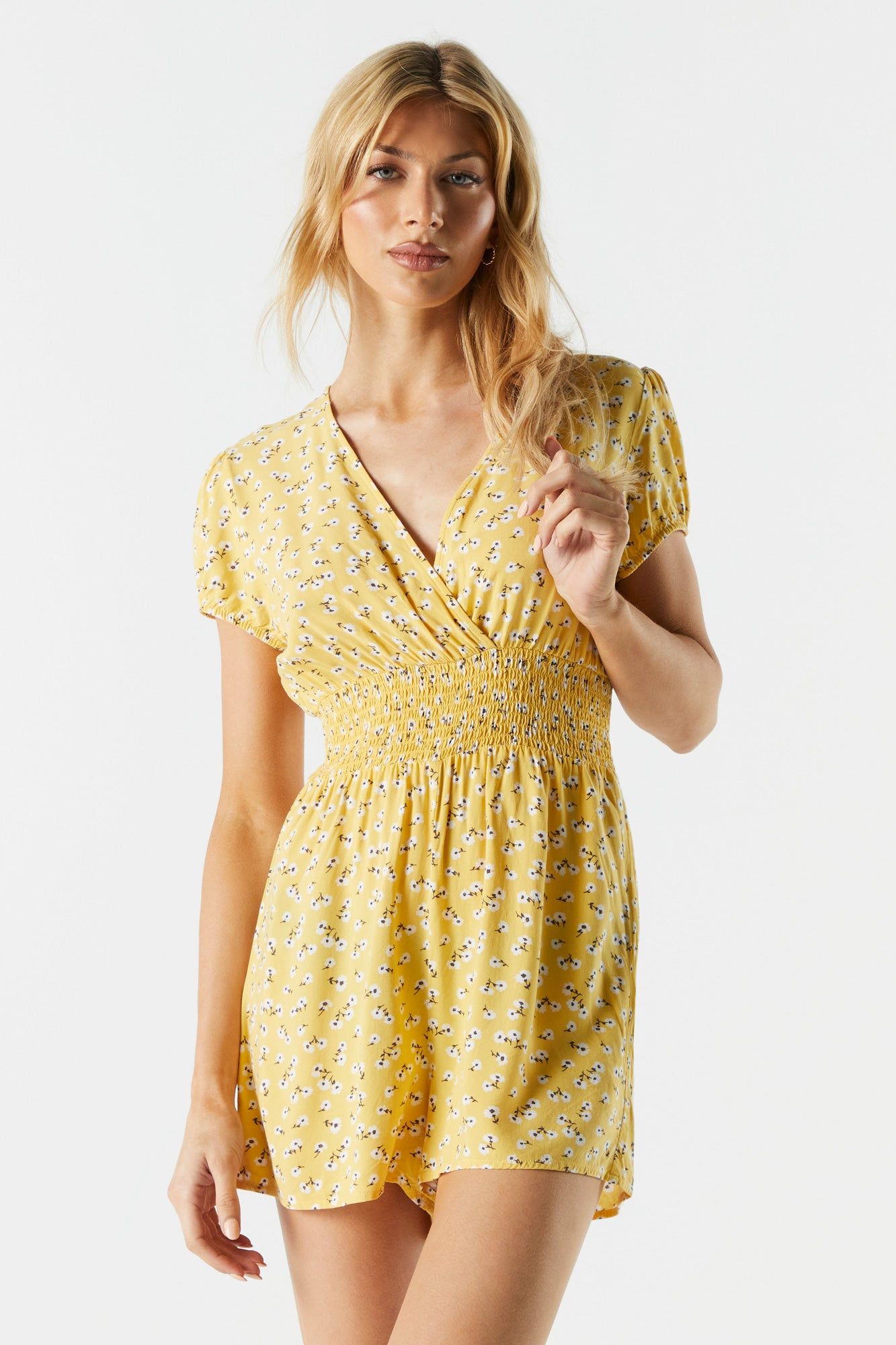 Yellow Floral Surplice Smocked Romper sold by Charlotte Russe