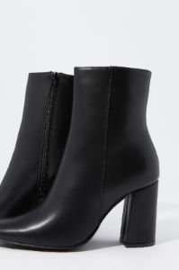 Faux-Leather Heeled Boot sold by Charlotte Russe