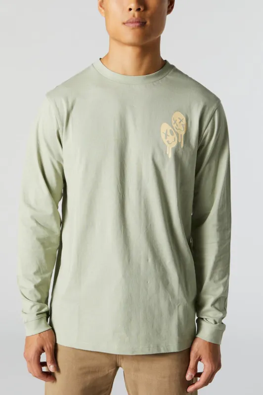 Dripping Smiley Graphic Long Sleeve Top sold by Charlotte Russe