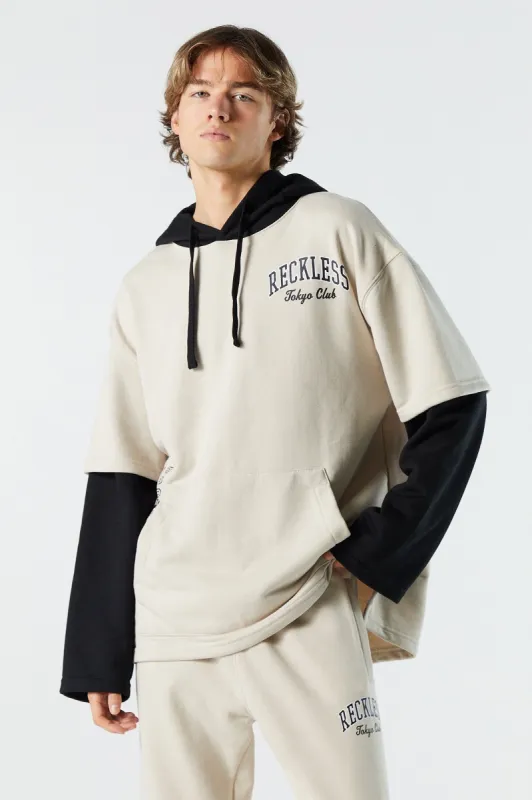 Reckless Graphic Fleece Layered Hoodie sold by Charlotte Russe