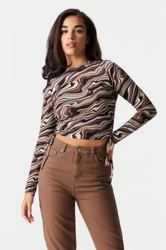 Marble Print Cinched Long Sleeve Crop Top sold by Charlotte Russe