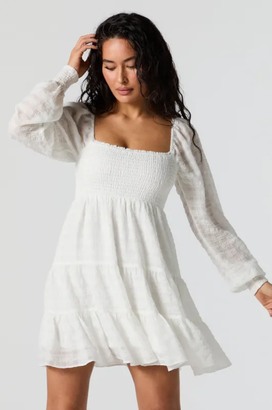 Smocked Tiered Long Sleeve Mini Dress sold by Charlotte Russe