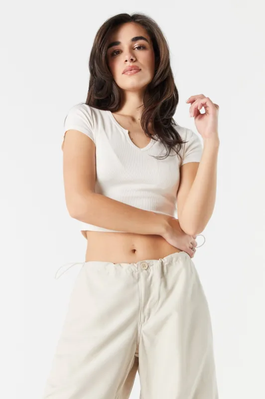Ribbed Notched Cropped T-Shirt sold by Charlotte Russe