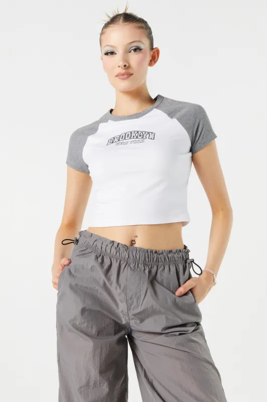 Brooklyn Graphic Cropped Raglan T-Shirt sold by Charlotte Russe