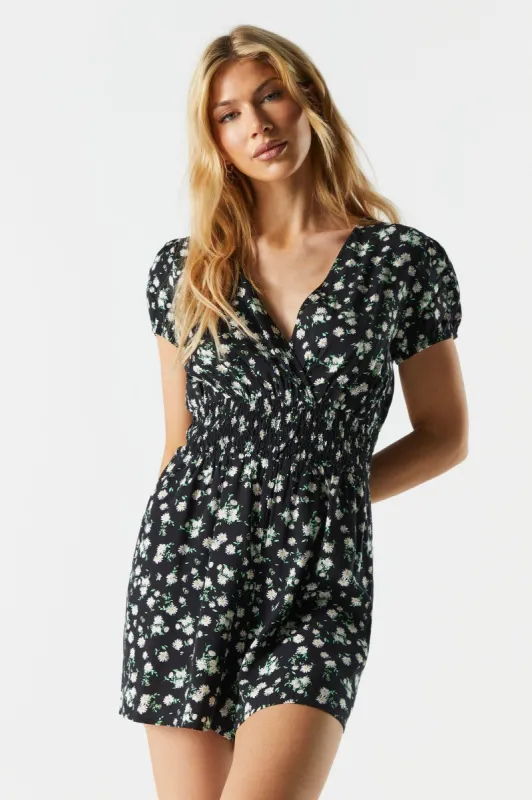 Black Floral Surplice Smocked Romper sold by Charlotte Russe