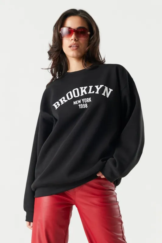Brooklyn Graphic Fleece Sweatshirt sold by Charlotte Russe