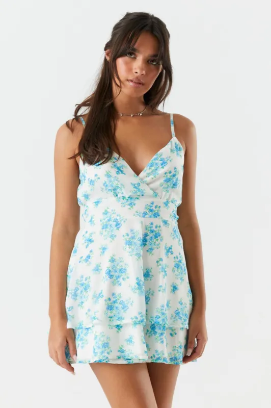 Blue Floral Surplice Tiered Romper sold by Charlotte Russe