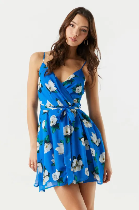 Blue Floral Chiffon Mini Wrap Dress sold by Charlotte Russe