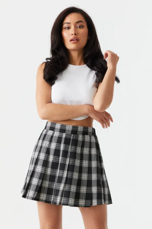 Pleated Black Plaid Print Twill Mini Skirt sold by Charlotte Russe
