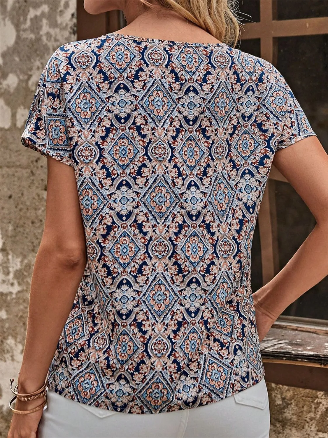 Cutout Printed Round Neck Short Sleeve Blouse sold by Charming Charlie product image thumbnail 2