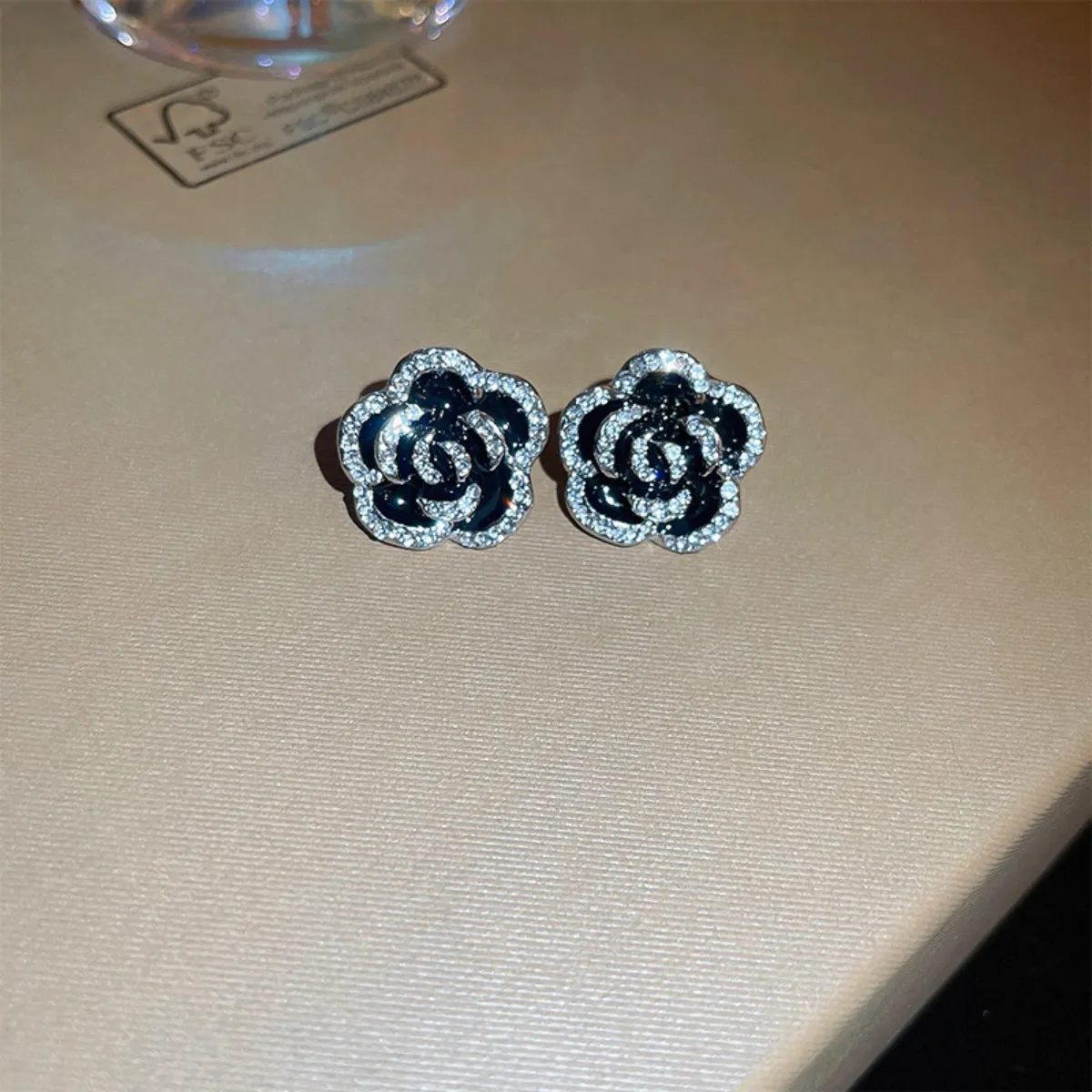 Copper Rhinestone Flower Earrings sold by Charming Charlie