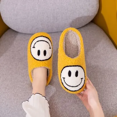 Melody Smiley Face Slippers sold by Charming Charlie