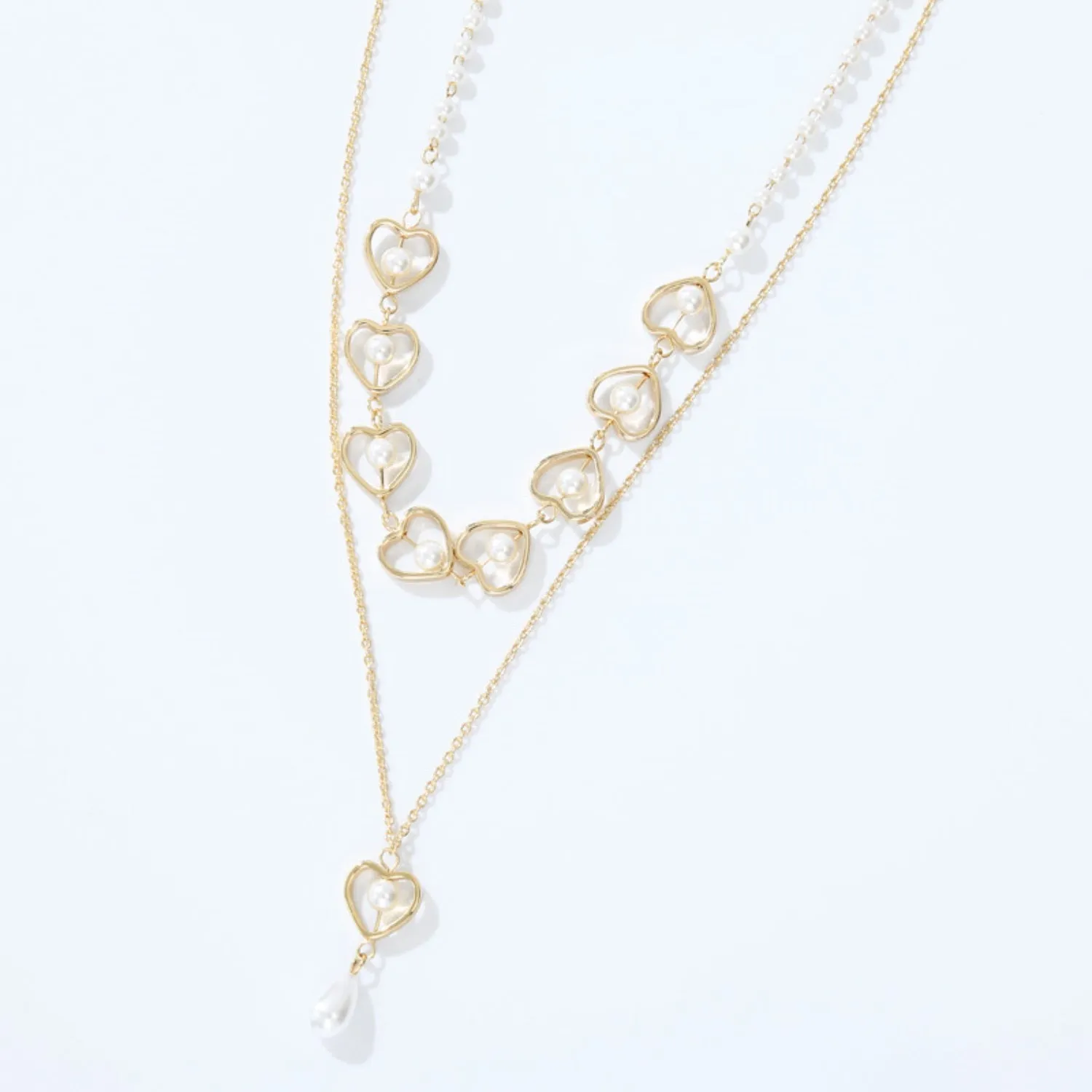 Double-Layered Heart & Pearl Pendant Necklace sold by Charming Charlie